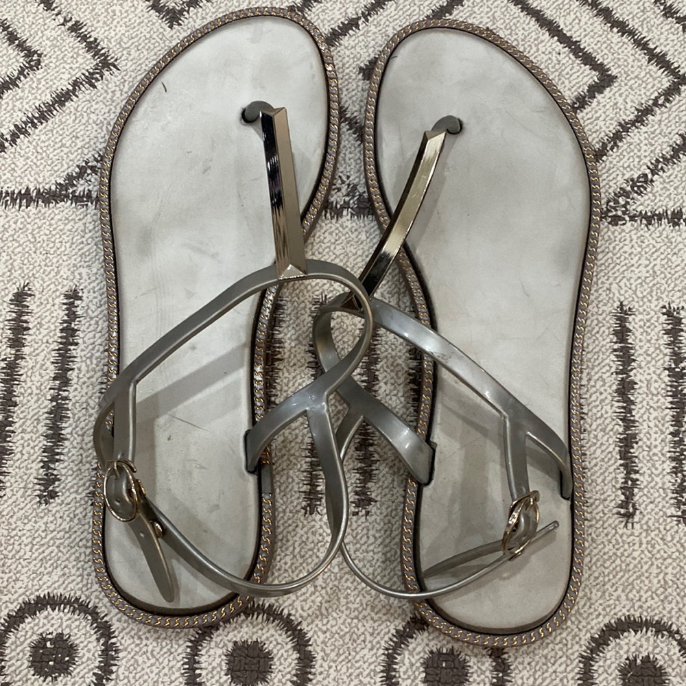 Silver sandals with silver detail.